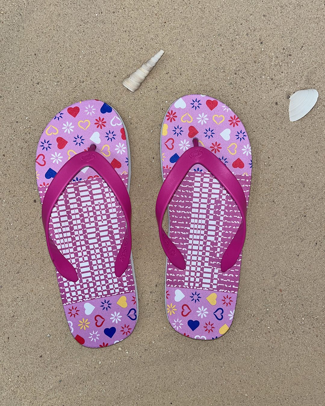 Pink secret message flip flops seen from above