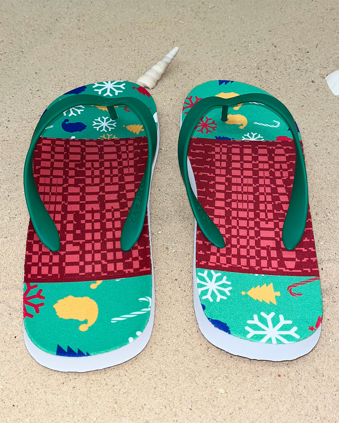 The Christmas flip-flops seen from the heel, revealing their hidden message