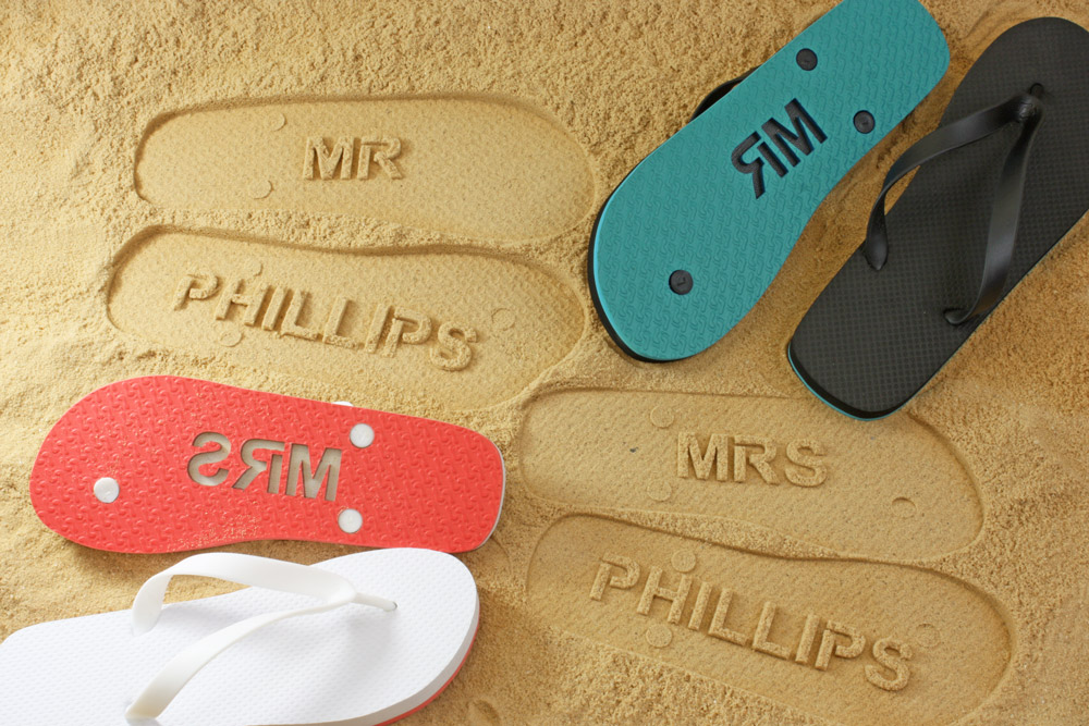 Mr and Mrs sand imprint flip flops